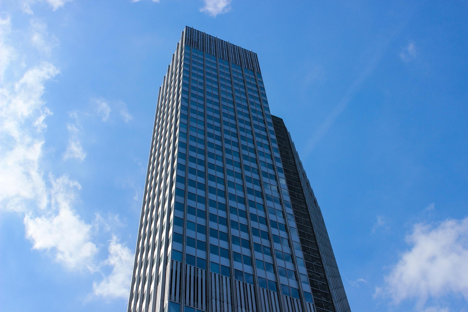 Modern commercial building exterior representing security and building automation solutions